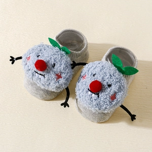 Detail of plush anti-slip baby floor socks with cartoon 3D monster design in light blue