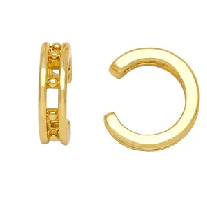 Double-layered gold ear cuff with metal bead accents in minimalist geometric style