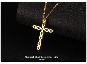 Macro shot showing the polished gold finish and textured back of the cross pendant necklace