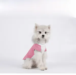 Close-up of pink and white color-block pet shirt with breathable fabric on a puppy