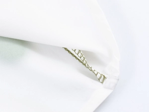 Detail shot of the white fabric with olive green stitching on the shirt collar