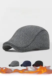 Detail of wool fabric texture on winter flat cap with ear protection for outdoor warmth
