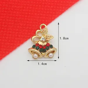 Detailed view of Christmas bell pendant with red green rhinestones and faux pearls 1.8x1.4cm