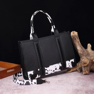 Bolso boho negro con correas de cuero sintético con estampado de vaca y detalles trenzados