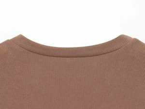 Detailed close-up of brown knit loungewear set featuring a ribbed round neckline