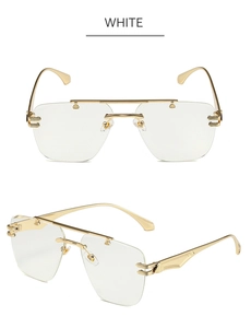 Detail view of rimless sunglasses with gold metal temples and clear white lenses