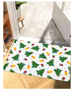 Christmas entryway mat featuring festive tree and gift patterns on a wooden floor