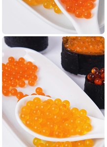 Macro view of realistic orange caviar beads in a white spoon for dollhouse food DIY