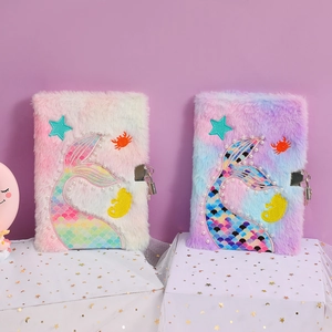 Rainbow tie-dye plush mermaid tail notebook with a metal lock and sequin details