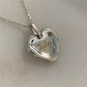 Minimalist 925 sterling silver necklace featuring an irregular heart pendant engraved with July
