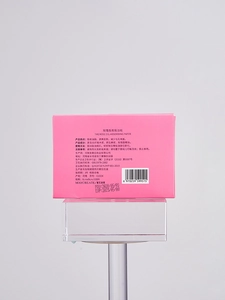 Detailed back view of pink oil absorbing tissues packaging with product specifications
