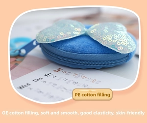 Detail of blue plush coin purse showing the PE cotton filling and sequin bow detail