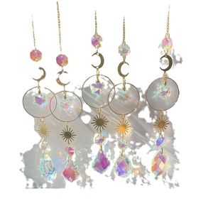 Set of 5 gold sun catchers with crystal moons and stars reflecting rainbow light