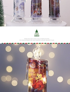 Detail showing lighted Christmas LED candle with festive reindeer and forest illustration