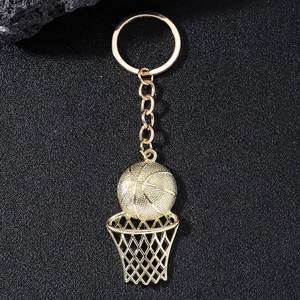 Creative gold basketball hoop keychain with mini basketball pendant on a matte background