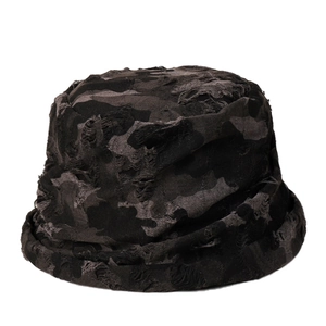 Distressed dark camo bucket hat with torn details and frayed edges for street style