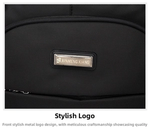 Close-up of a silver metal logo plaque on a textured black nylon business backpack