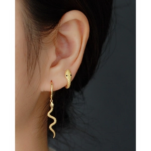 Chic gold S925 sterling silver snake hoop earrings with textured scale details on model