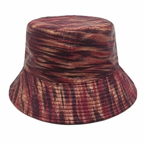Detail of vintage bucket hat featuring metallic bronze and red wavy velvet texture