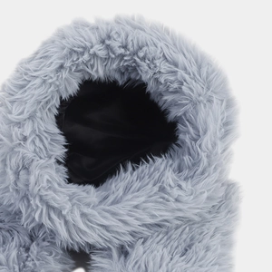 Close-up of gray-blue plush fur texture with black satin lining for winter hat detail