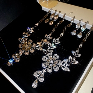 Macro shot of elegant floral jewelry set with sparkling rhinestones in a display box