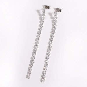 Elegant long tassel earrings in silver finish with sparkling zircons on white background