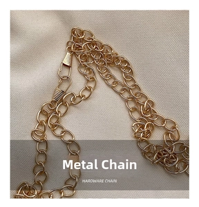 Close-up of a polished gold-tone metal chain with high-quality spring ring clasp