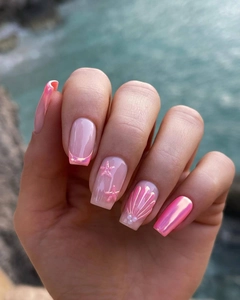 Macro detail of 3D shell texture and starfish pearls on pink aurora square press-on nails
