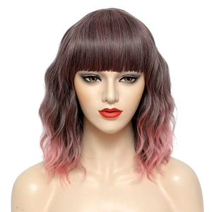 Detailed macro view of the soft pink gradient fibers and smooth bangs on the short wavy wig