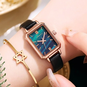 Elegant rectangle rose gold watch with gradient green dial and black leather strap on wrist
