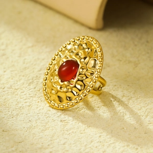 French vintage stainless steel gold ring with oval red gemstone and hammered texture