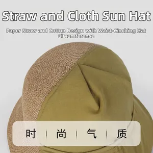 Dettaglio cappello da sole in lino con cotone verde oliva e cuciture in paglia