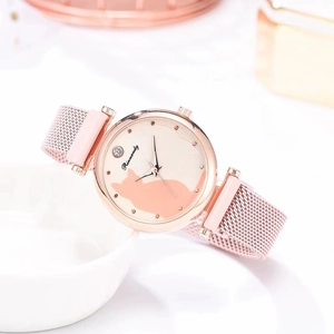 Macro detail of rose gold cat-patterned dial and mesh band with magnetic buckle