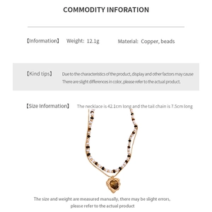 Size chart showing 42.1cm length heart necklace made of copper and beads