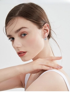Detail of s925 silver irregular earring with moissanite stone shown on model ear