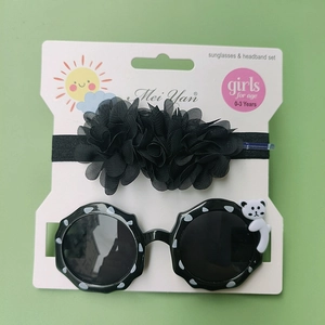 Detail of girl's black sunglasses with panda motif and floral headband set for 0-3 years