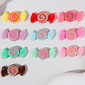 Detailed view of colorful resin spiral lollipop charms for DIY crafts and accessories