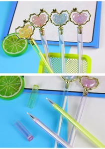 Detail of colorful crystal heart gel pens with electroplated caps and transparent barrels