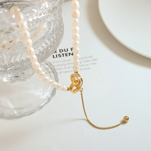 Vintage Baroque pearl necklace with interlocking gold rings and Roman numeral zircon pendant