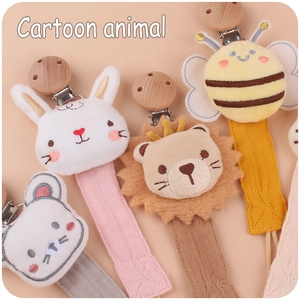 Detailed collection of cartoon plush animal pacifier clips with beech wood accents