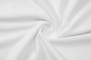 Detailed macro view of high-quality white fabric texture with soft drapery and fine weave