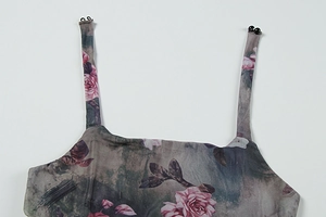 Detail of sheer mesh dress with vintage rose floral print and delicate thin straps