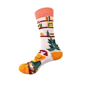Detail of pink cotton socks featuring home life illustrations and orange contrast toe