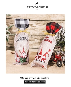 Detail of linen Christmas gnome wine bottle bags with plaid trim and gold ribbons