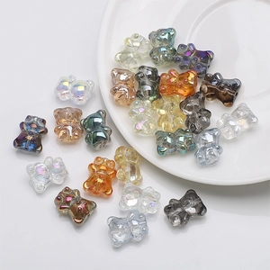 Macro detail of colorful 3D crystal bear charms with iridescent finish for DIY jewelry