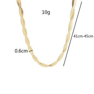 Macro detail of intertwined gold titanium snake chains with 0.6cm width and 10g weight