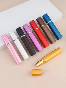 Close-up of fine spray nozzles on portable 12ml matte metal travel perfume atomizers