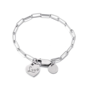 Silver chain bracelet with engraved Love heart pendant and circular charm on white backdrop