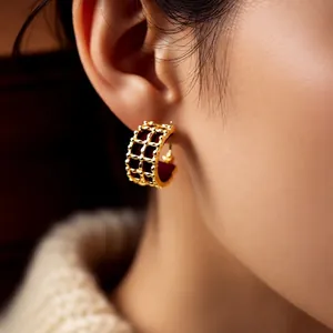 18K gold plated C-shaped hollow hoop earrings with red velvet inlay on a model