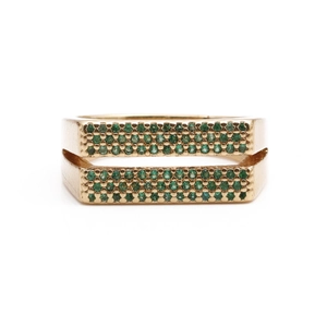 Golden double-layered ring with emerald green zircon pavé settings on white background